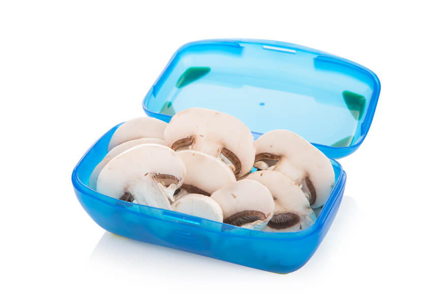 sliced mushrooms in a small container 