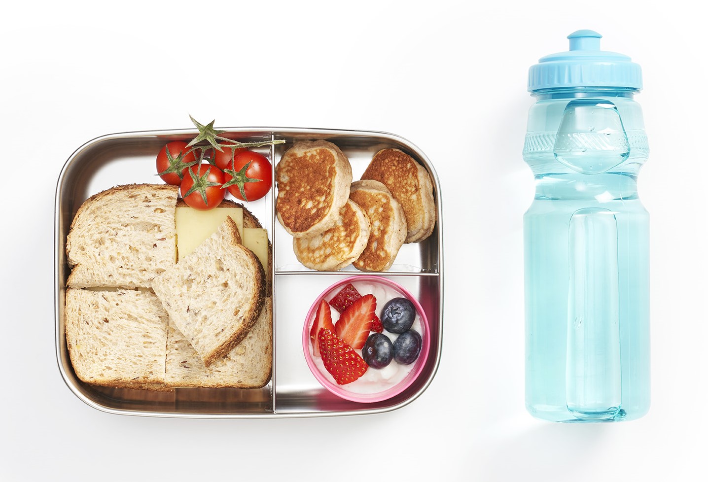 Lunchbox with cheese sandwhich and berry yoghurt, with water bottle 
